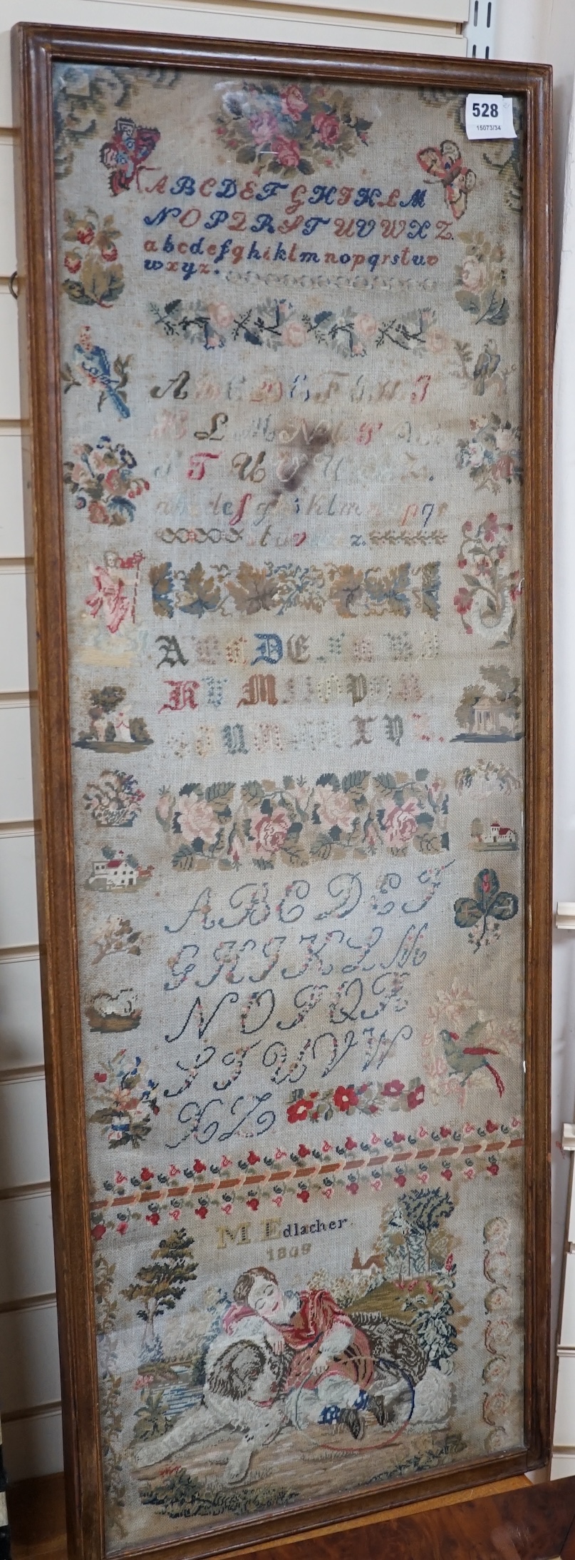 Two mid 19th century embroideries; a framed sampler dated 1809 and an embroidered figurative panel, largest 114 x 42cm. Condition - poor